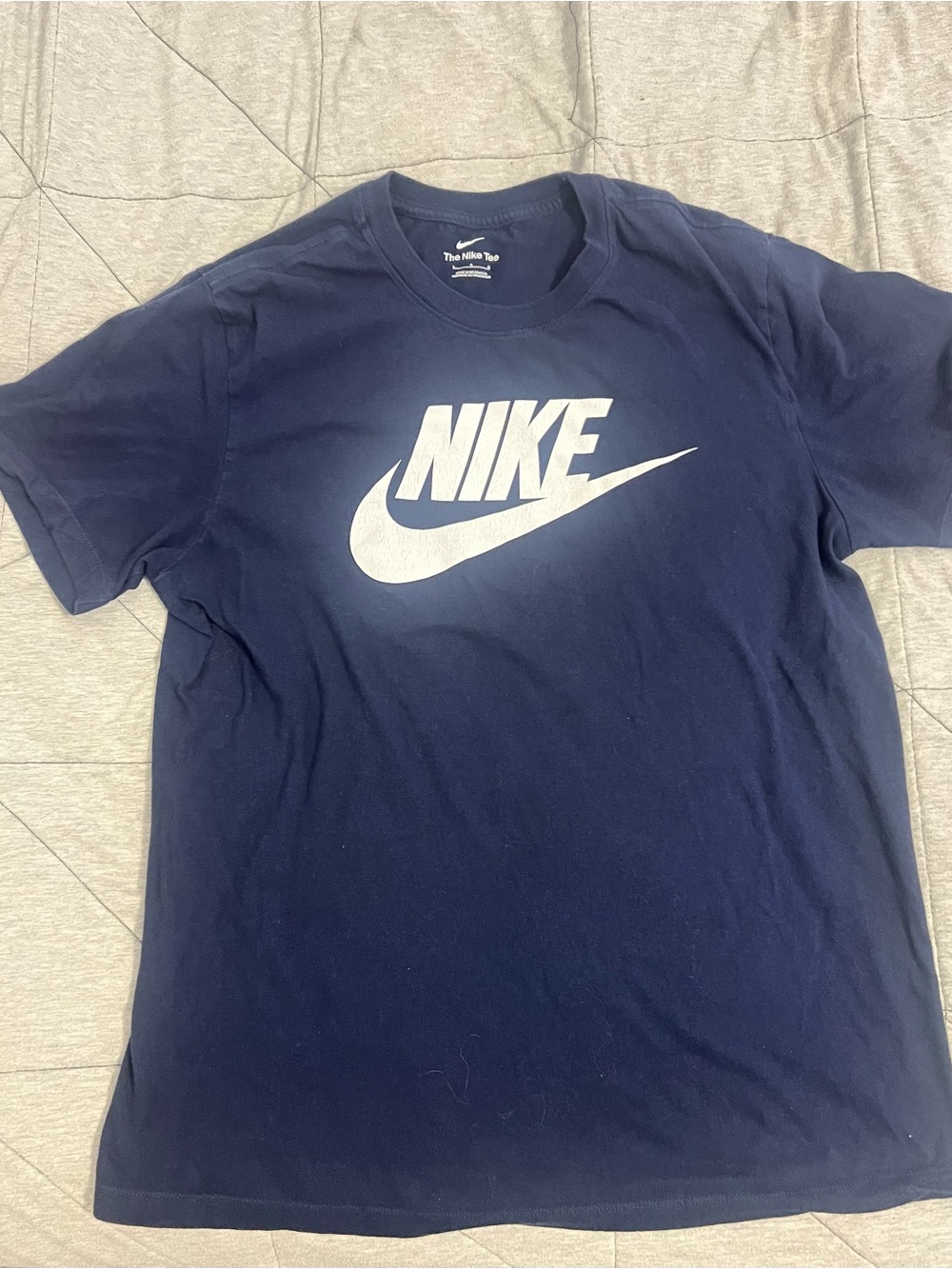Nike Men's Navy T-Shirt with White Swoosh Logo